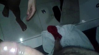 Masked man ejaculates on chestnut-haired woman's face in BDSM video