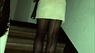 Leather clad femdom in pantyhose and miniskirt