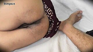 stepmom watches movie with husband in cozy setting.